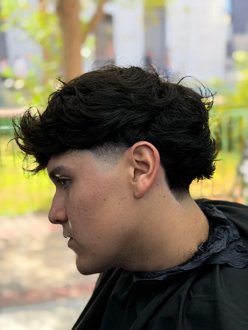 Corte mullet moderno con degradado realizado en La Cuadra Barber Studio Santiago Centro